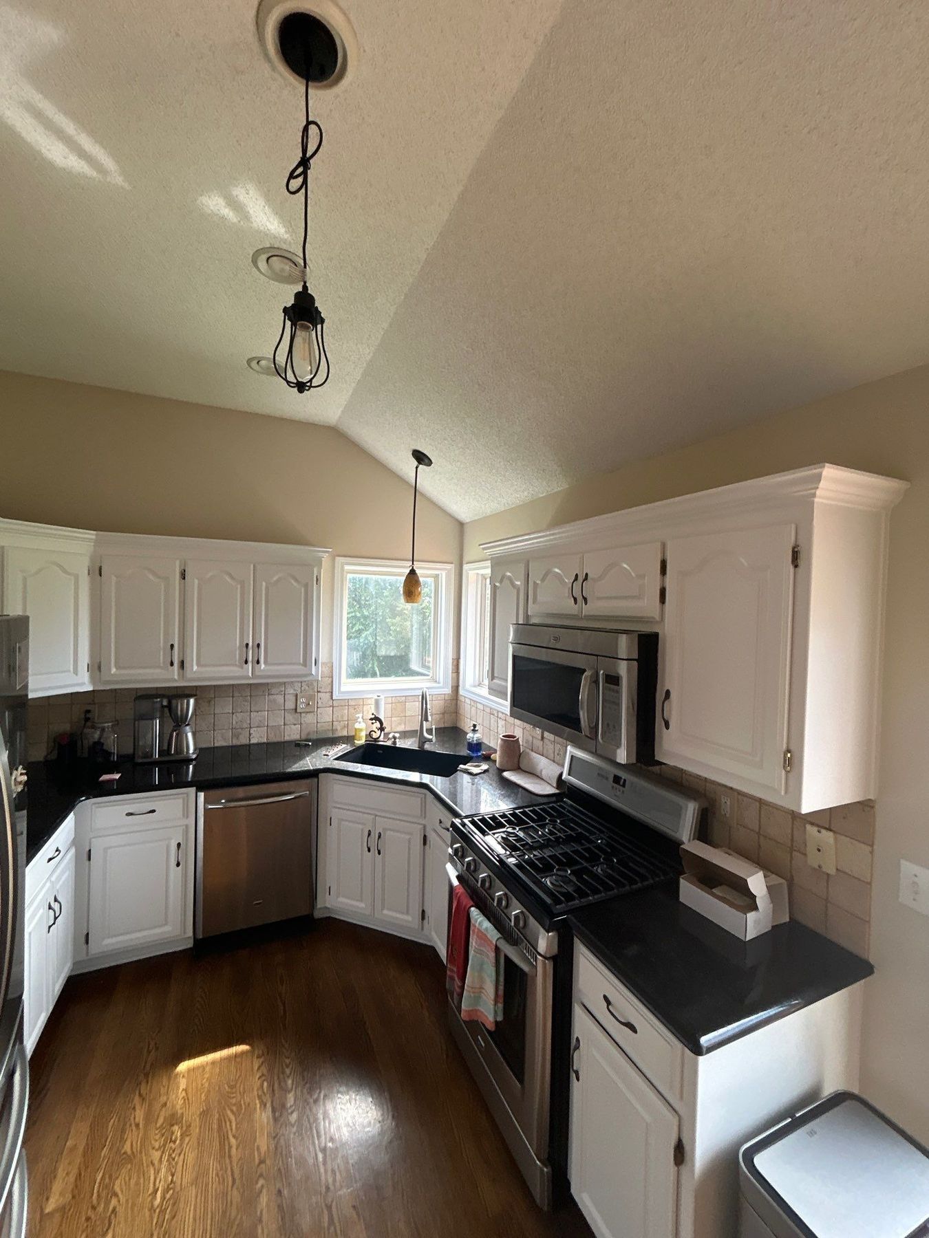 After โ same kitchen with cabinets sprayed a clean bright white by EverPro Painting
