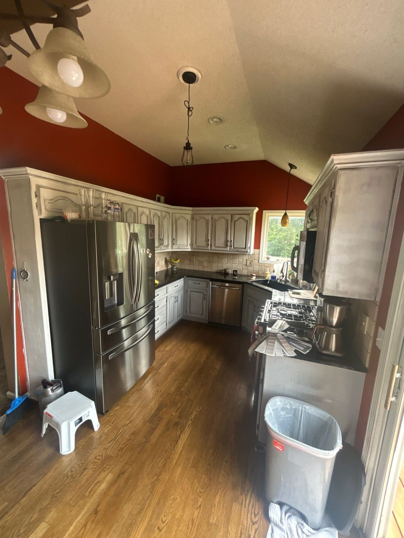 Before โ dated whitewashed oak kitchen cabinets in Kansas City
