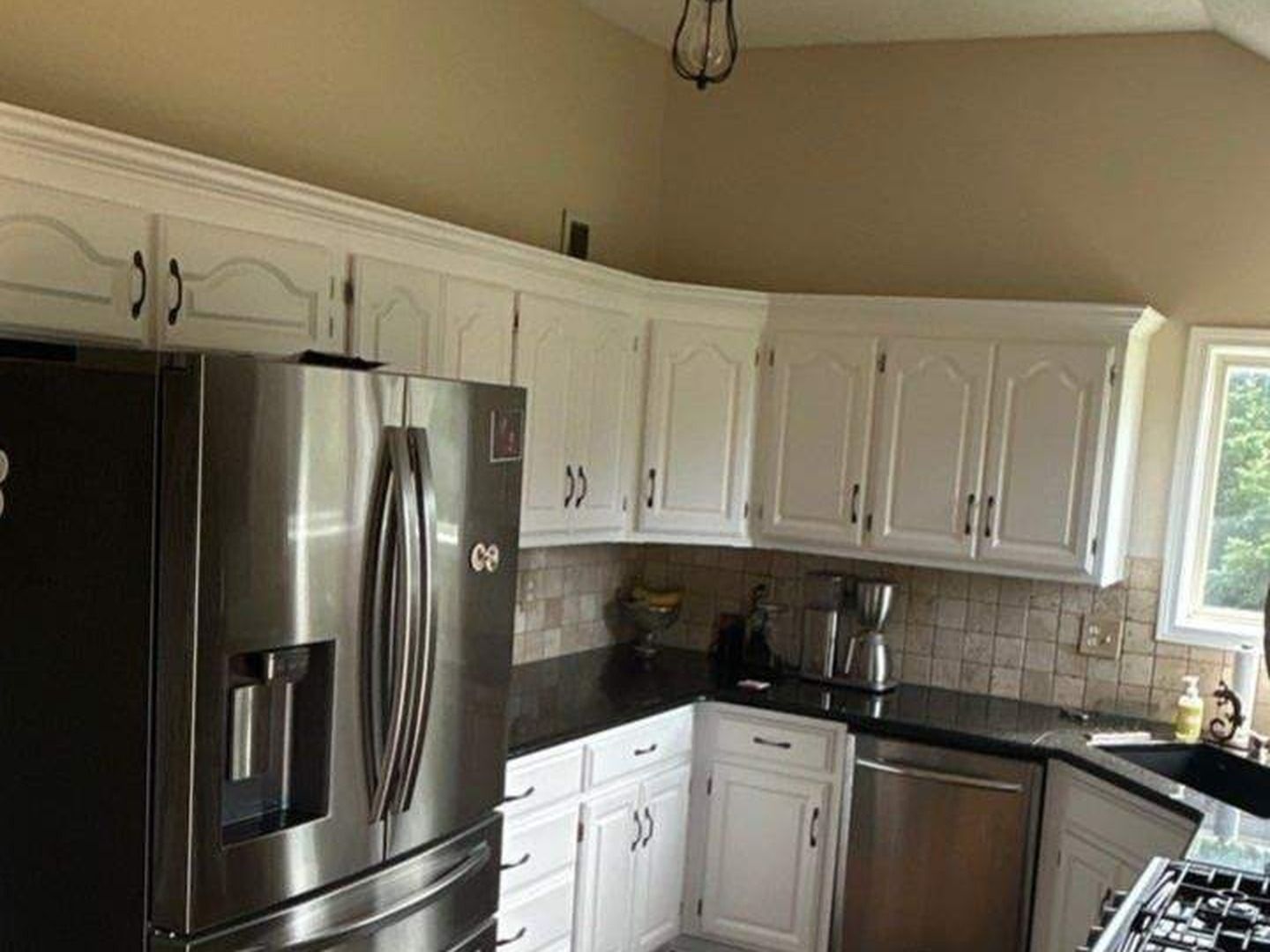 Cabinet painting in Kansas City — kitchen cabinets refinished white