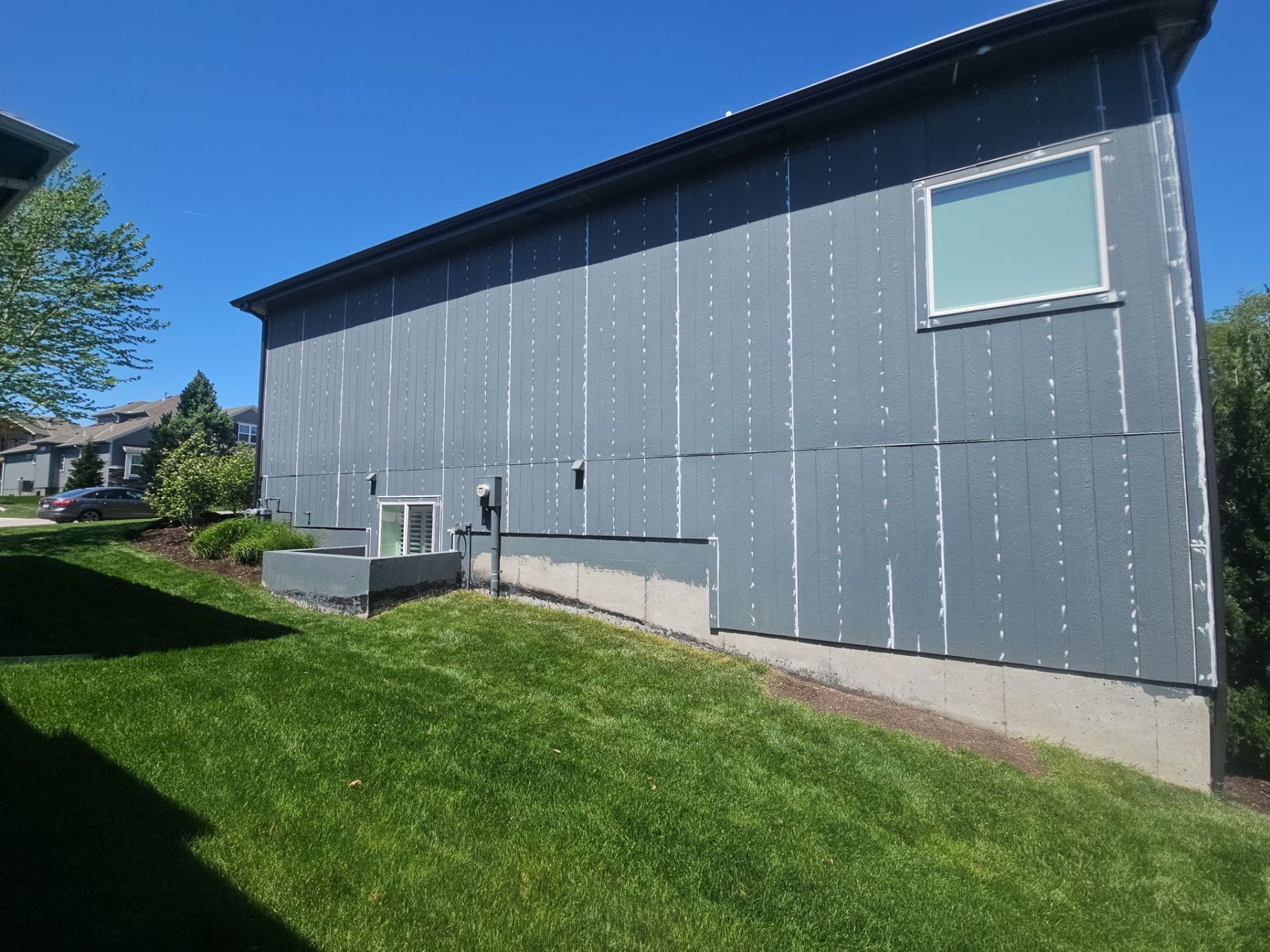 Exterior prep by EverPro Painting — every nail hole and seam caulked with Sherwin-Williams SherMAX before painting